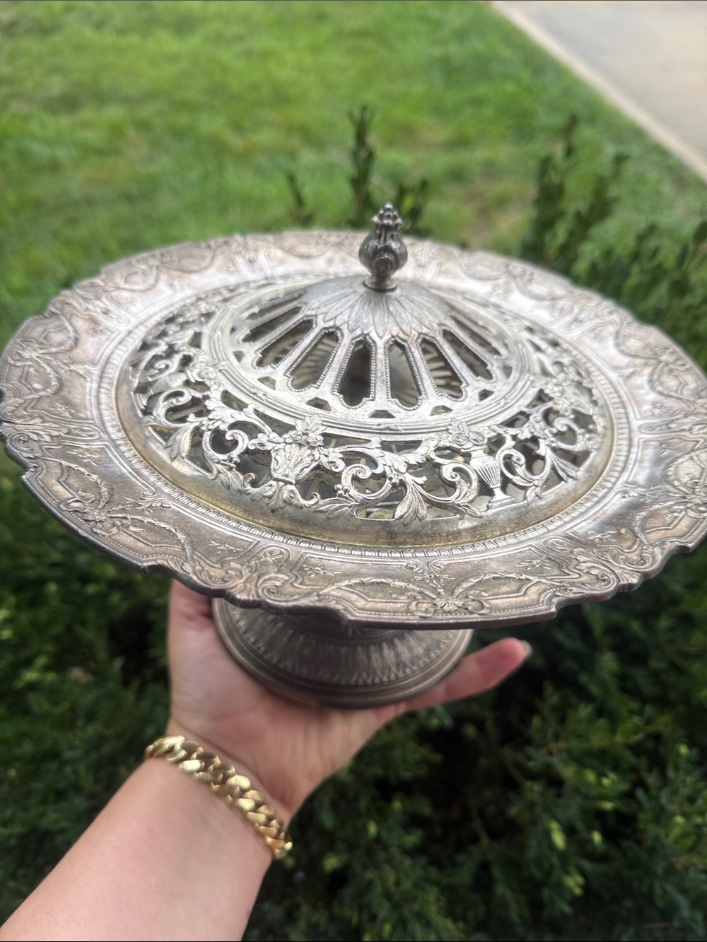 Antique silverplate floral centerpiece bowl featuring an ornate pierced flower